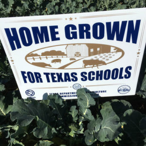 Home Grown For Texas Schools sign in a garden